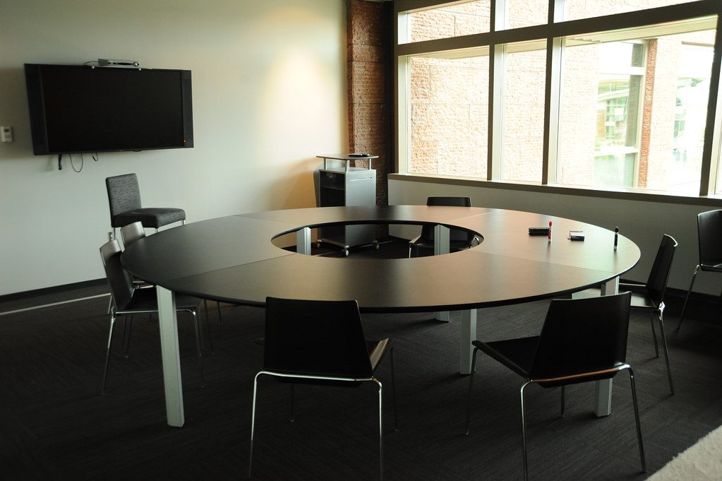 Conference room with wall display for simple one-touch boardroom AV control