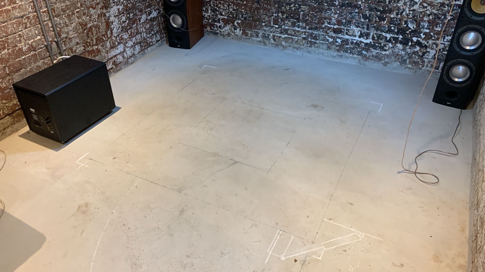 Speaker positioning being considered before furniture and room finishes are finalised