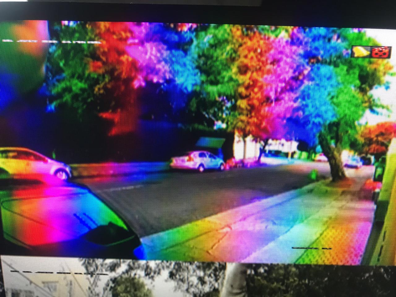 Old analogue CCTV camera view showing unstable image quality
