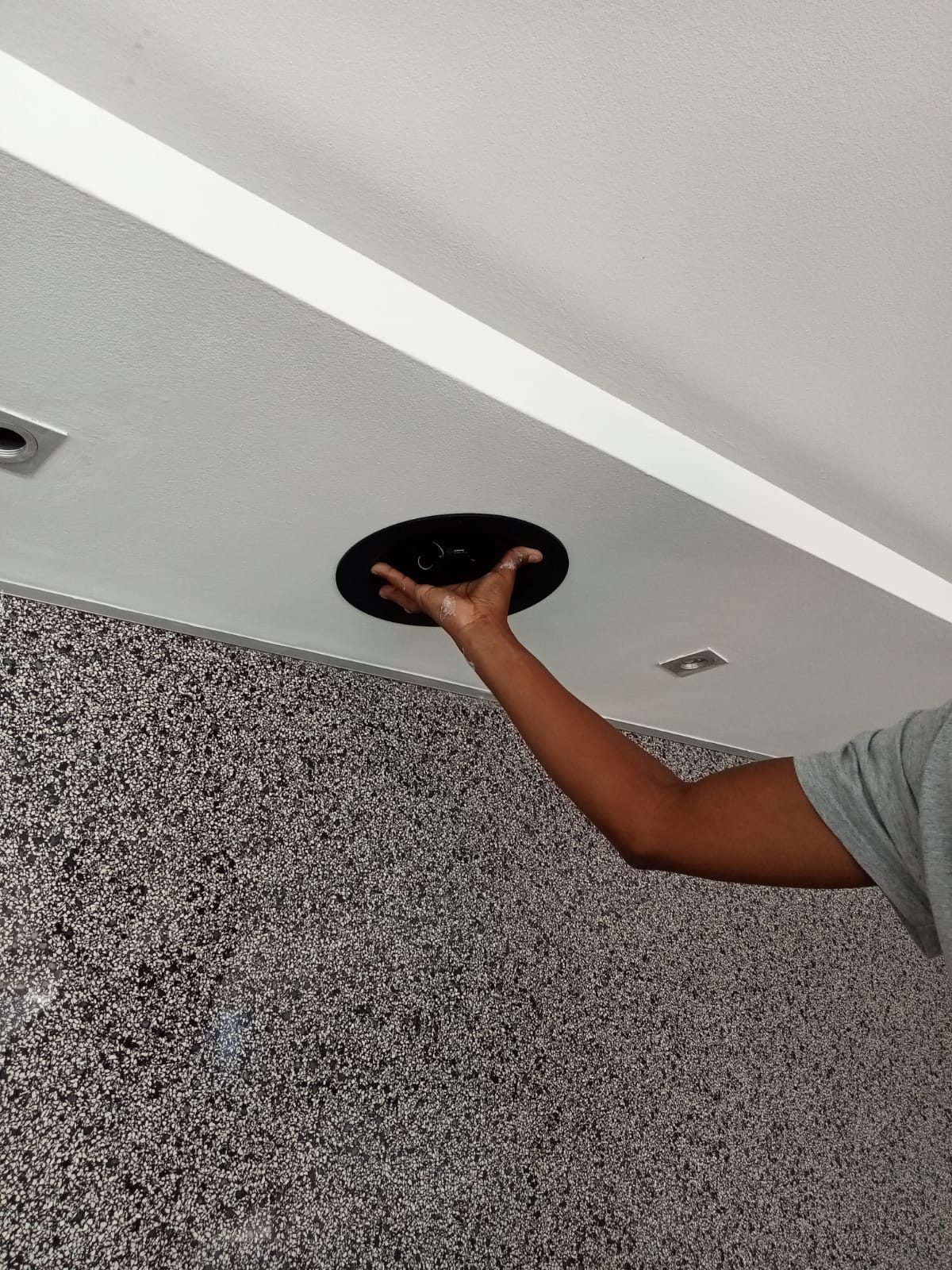 General technician fitting inceiling speaker