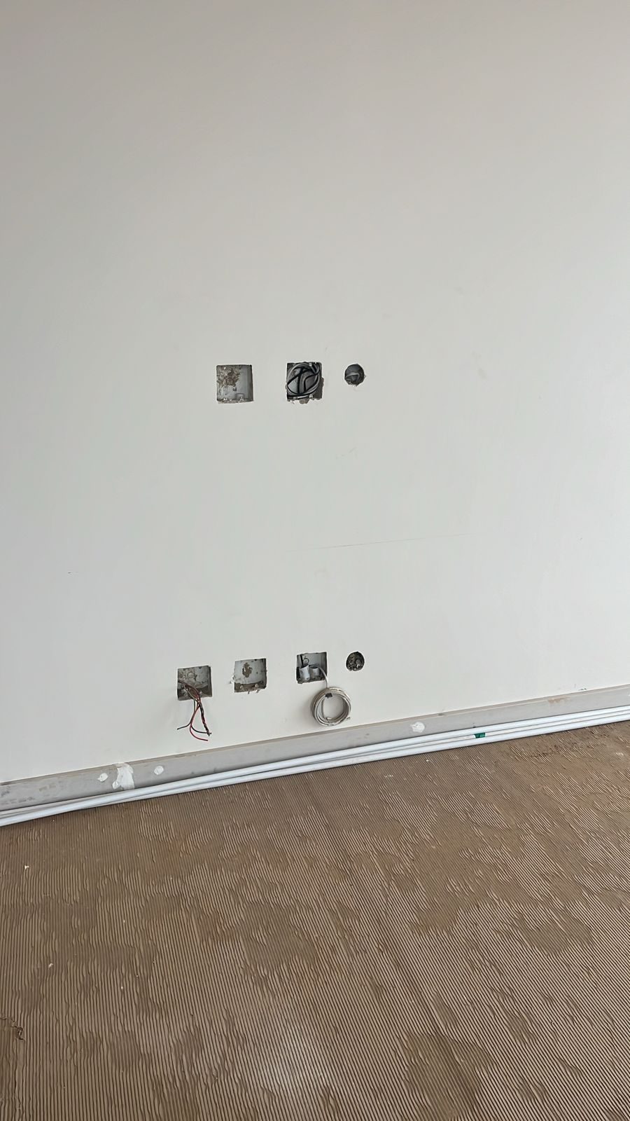 all wiring in place before furniture/cabinetry comes in