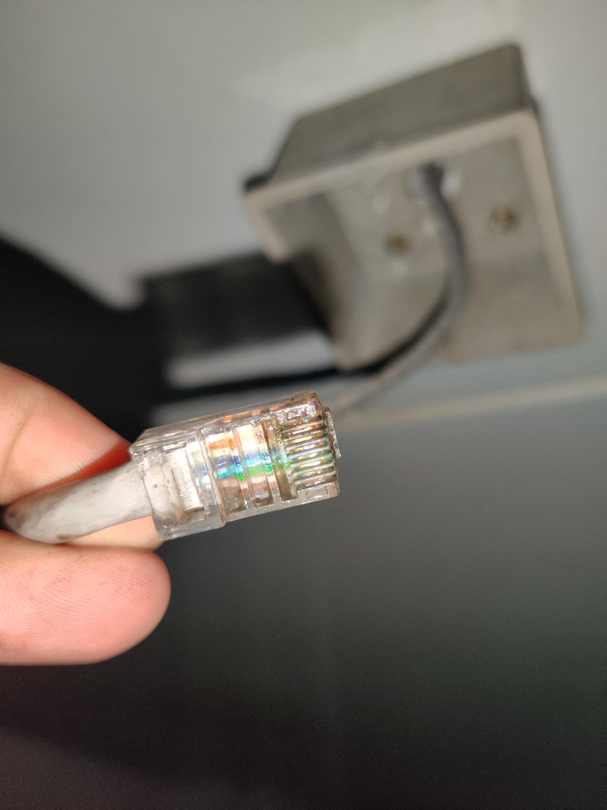 Close-up of a damaged RJ45 plug from a CCTV fault