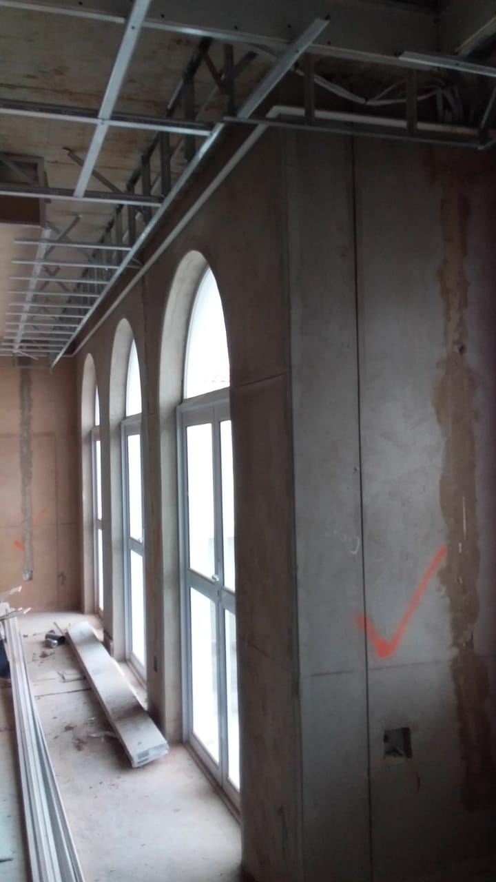 Open ceiling and unfinished walls during low-voltage first-fix planning